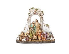 Kneeling Nativity with Stone Wall